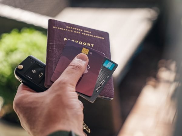 person holding black and brown book